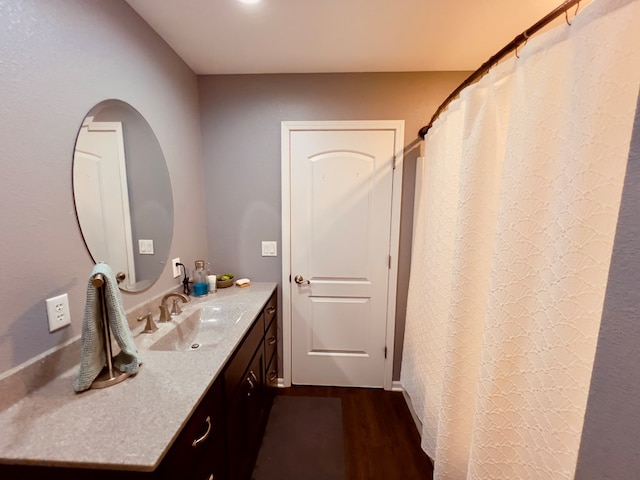 bathroom featuring wood-type flooring and vanity