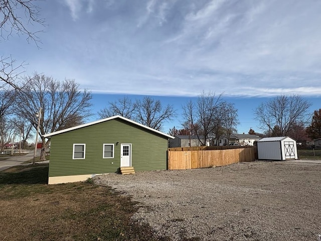 exterior space with a storage shed