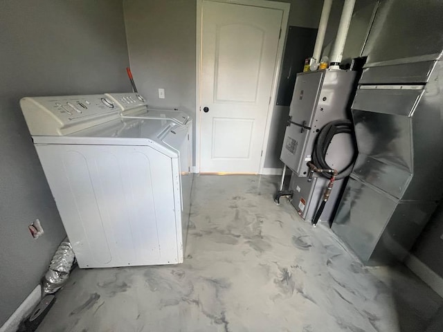 laundry room featuring washing machine and clothes dryer