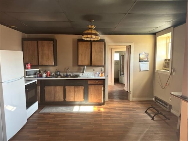 kitchen with hanging light fixtures, dark hardwood / wood-style flooring, white refrigerator, stove, and a paneled ceiling