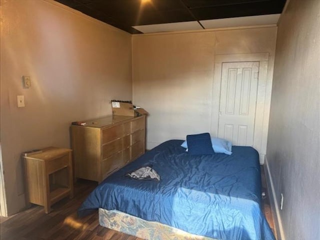 bedroom featuring dark wood-type flooring