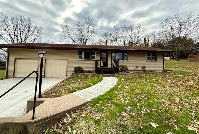 single story home with a garage and a front yard