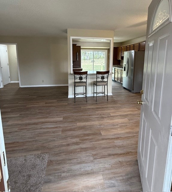 interior space with dark hardwood / wood-style floors and a textured ceiling