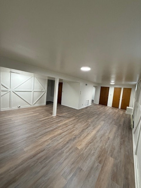 unfurnished living room with hardwood / wood-style flooring