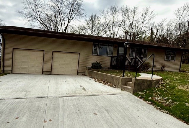 ranch-style house featuring a garage