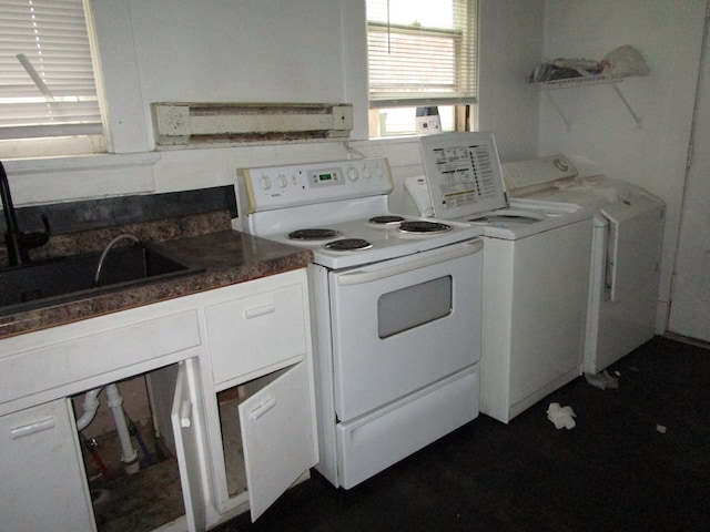 kitchen featuring separate washer and dryer, white electric stove, white cabinetry, and sink