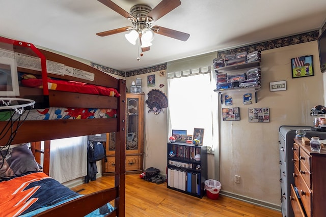 bedroom featuring ceiling fan and wood-type flooring