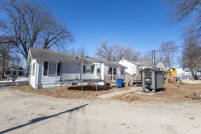 view of front of home with a playground