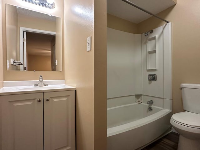 full bathroom featuring toilet, shower / washtub combination, and vanity