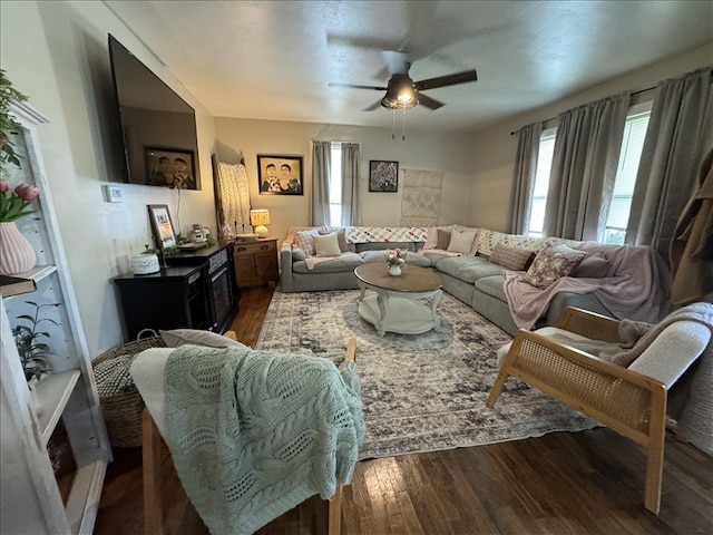 411 S Macon St, Bevier, MO 63532 - living room with ceiling fan and dark wood-style floors