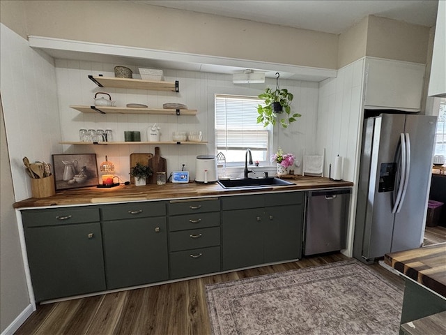 411 S Macon St, Bevier, MO 63532 - kitchen featuring appliances with stainless steel finishes, a sink, butcher block countertops, dark wood-style flooring, and gray cabinets