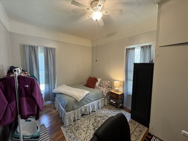 411 S Macon St, Bevier, MO 63532 - bedroom featuring wood finished floors, crown molding, and ceiling fan