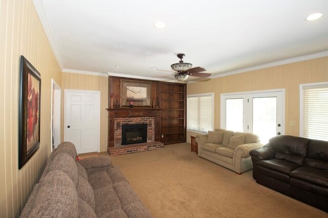 2110 Woodcrest Dr, Chillicothe, MO 64601 - living room with ornamental molding, ceiling fan, a fireplace, light colored carpet, and recessed lighting