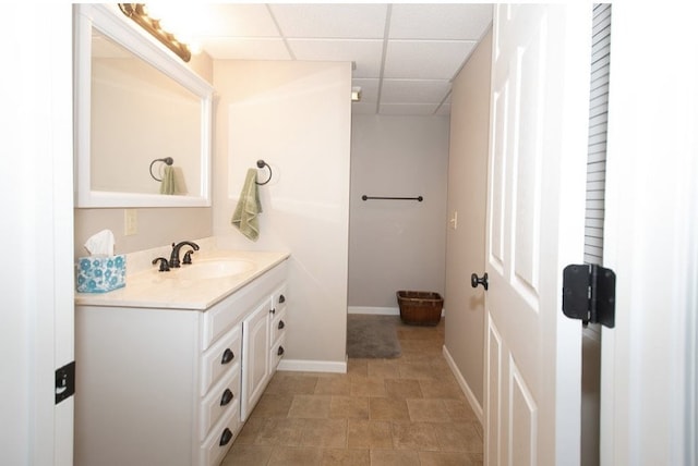 2110 Woodcrest Dr, Chillicothe, MO 64601 - bathroom with vanity, a paneled ceiling, and baseboards