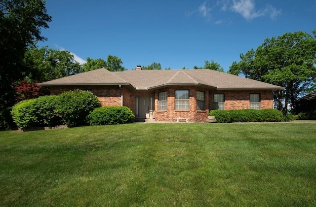 2110 Woodcrest Dr, Chillicothe, MO 64601 - ranch-style house featuring a front yard, brick siding, and a chimney