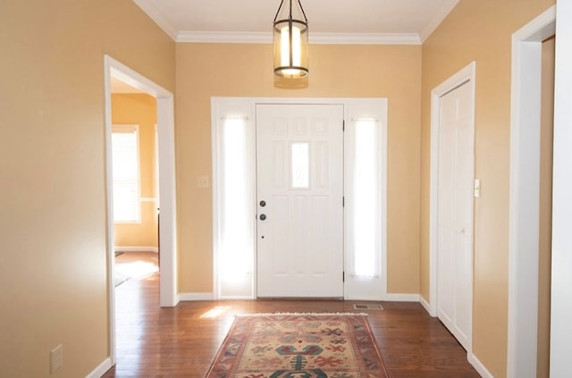 2110 Woodcrest Dr, Chillicothe, MO 64601 - entrance foyer featuring wood finished floors, crown molding, and baseboards