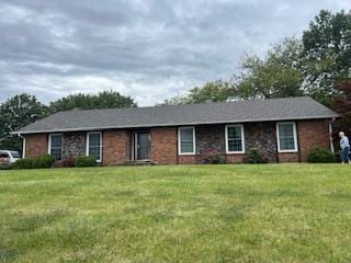 ranch-style house with a front lawn