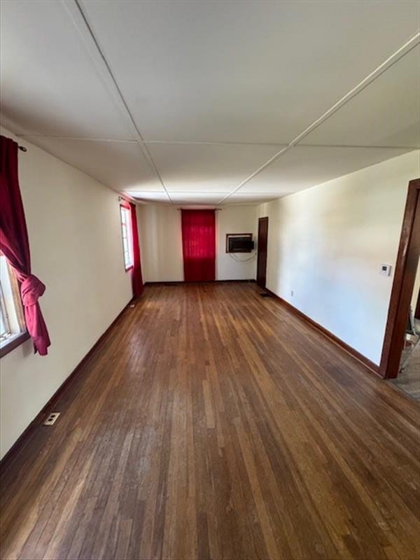 unfurnished room featuring dark hardwood / wood-style flooring