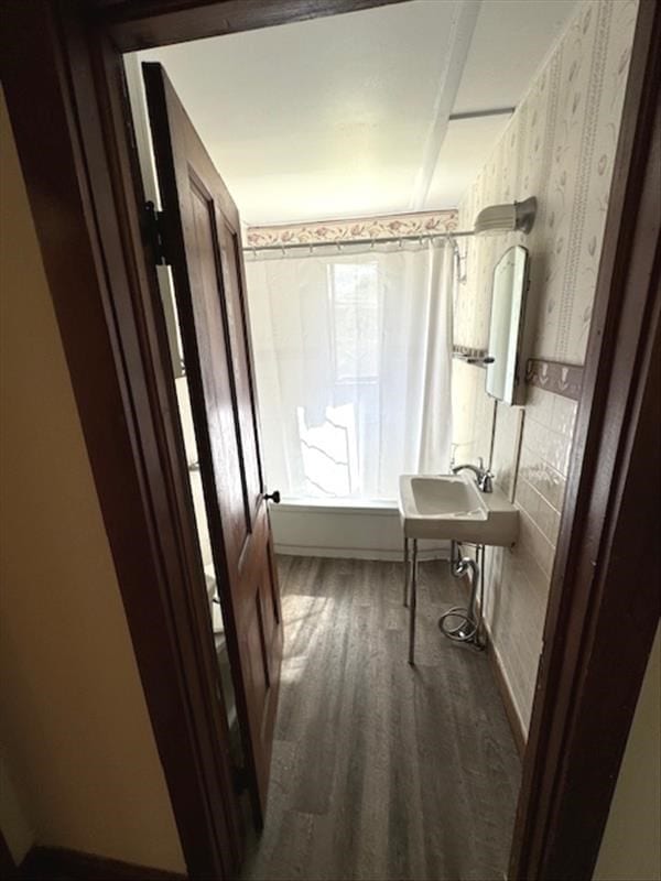 corridor featuring dark hardwood / wood-style flooring and sink