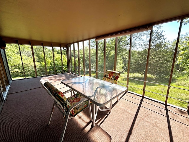 unfurnished sunroom with plenty of natural light