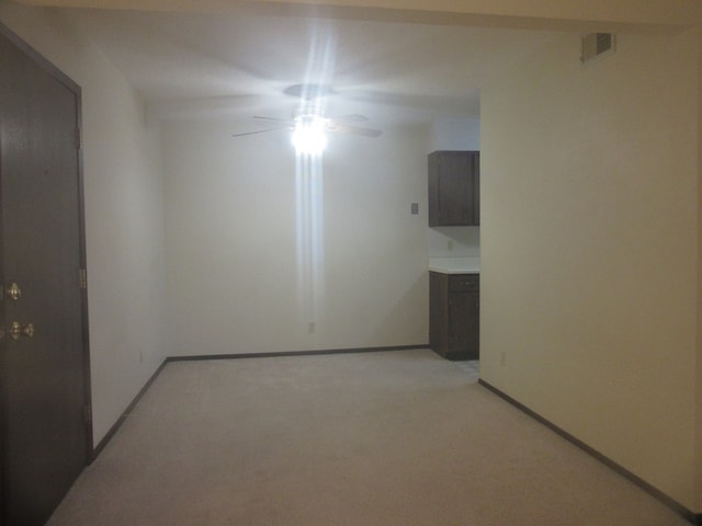 unfurnished room with ceiling fan