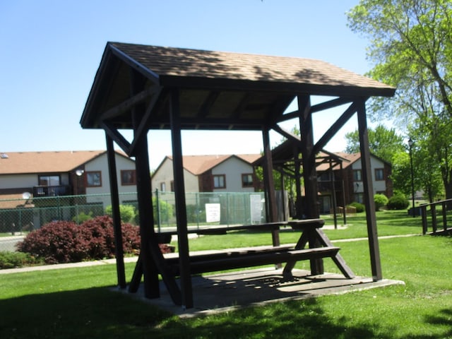 view of home's community with a gazebo and a yard