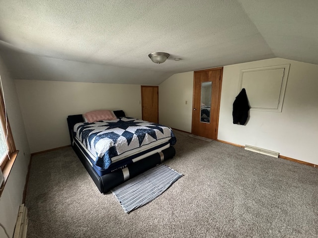 carpeted bedroom featuring lofted ceiling, a textured ceiling, and baseboard heating