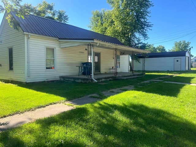 view of front of home with covered porch and a front yard