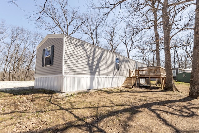 1018 Logue Ln, Keytesville, MO 65261 - view of side of property with a wooden deck and stairway