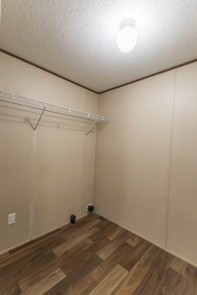 1018 Logue Ln, Keytesville, MO 65261 - washroom with laundry area, a textured ceiling, and dark wood finished floors