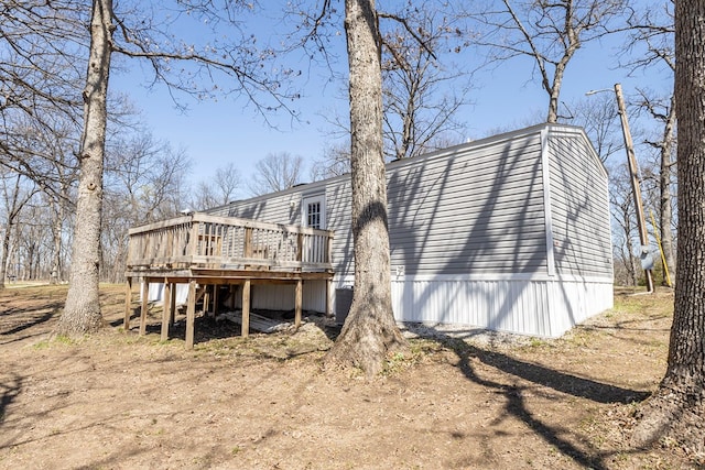 1018 Logue Ln, Keytesville, MO 65261 - back of property featuring central air condition unit and a wooden deck