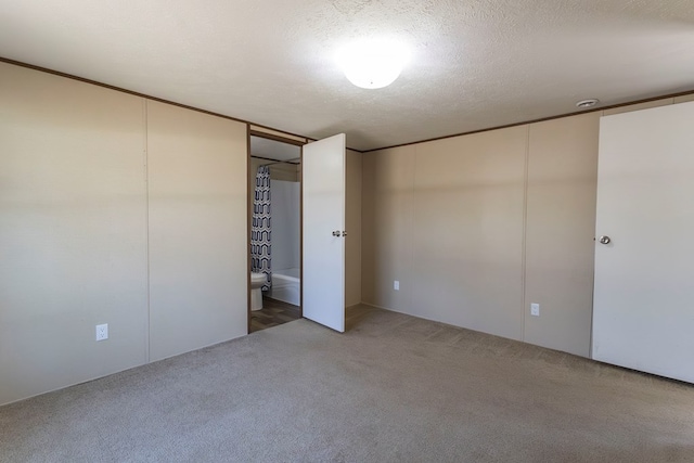 1018 Logue Ln, Keytesville, MO 65261 - unfurnished bedroom with carpet and a textured ceiling