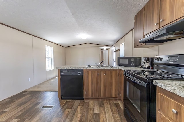 1018 Logue Ln, Keytesville, MO 65261 - kitchen with a peninsula, black appliances, under cabinet range hood, light countertops, and lofted ceiling