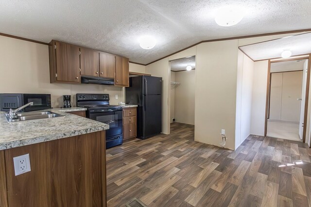 1018 Logue Ln, Keytesville, MO 65261 - kitchen featuring a sink, light countertops, dark wood finished floors, under cabinet range hood, and black appliances
