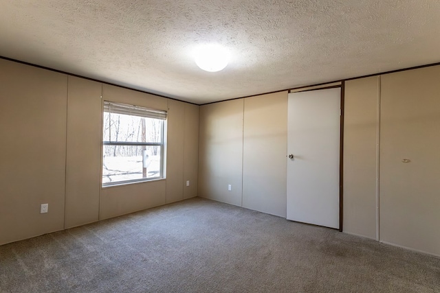 1018 Logue Ln, Keytesville, MO 65261 - unfurnished bedroom with carpet flooring and a textured ceiling
