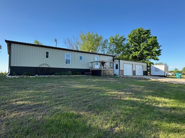 49615 Peach Rd, Milan, MO 63556 - rear view of property with a yard and a garage