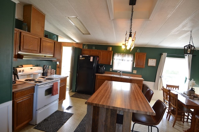 49615 Peach Rd, Milan, MO 63556 - kitchen with electric stove, freestanding refrigerator, under cabinet range hood, light flooring, and wooden counters
