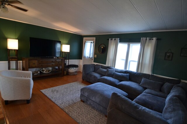 49615 Peach Rd, Milan, MO 63556 - living area with lofted ceiling, wood finished floors, a wainscoted wall, ceiling fan, and ornamental molding