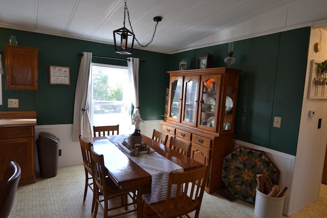 49615 Peach Rd, Milan, MO 63556 - dining space with a decorative wall, lofted ceiling, and a wainscoted wall