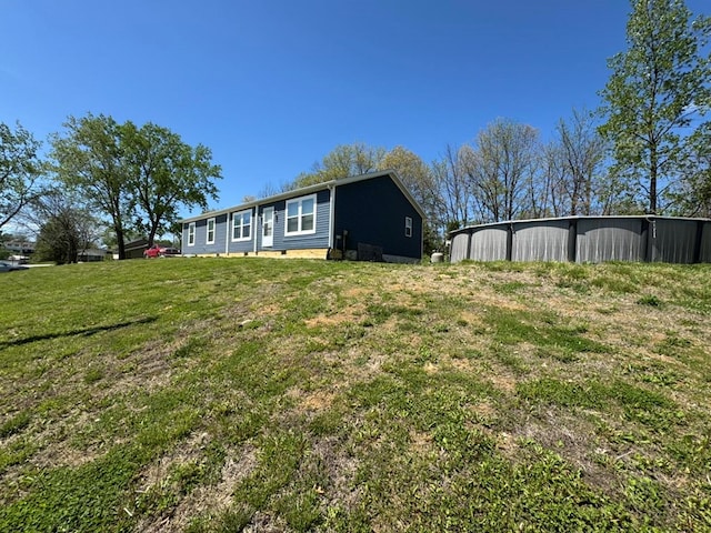 501 SE State St, Milan, MO 63556 - view of yard featuring a pole building and an outbuilding