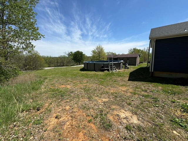 501 SE State St, Milan, MO 63556 - view of yard with an outdoor pool