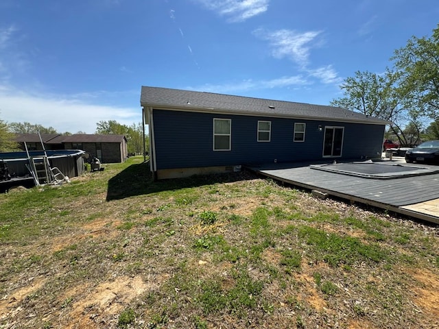 501 SE State St, Milan, MO 63556 - rear view of property featuring a yard, a deck, and a covered pool
