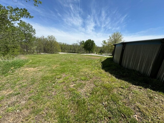 501 SE State St, Milan, MO 63556 - view of yard featuring an outbuilding