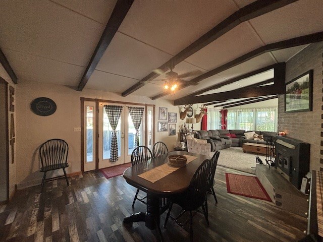 1715 E Mcpherson St, Kirksville, MO 63501 - living area with wood finished floors, a brick fireplace, and lofted ceiling with beams