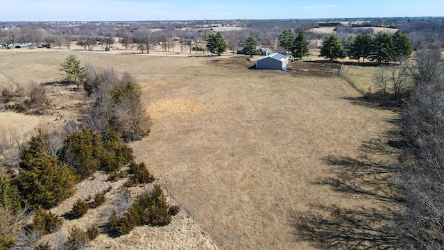 birds eye view of property featuring a rural view