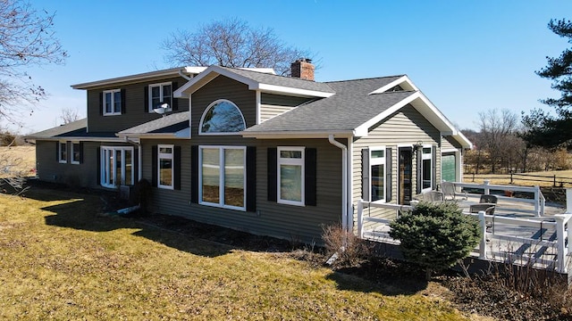 exterior space featuring a chimney, fence, a front lawn, and roof with shingles
