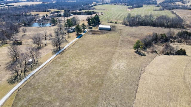 drone / aerial view with a rural view and a water view
