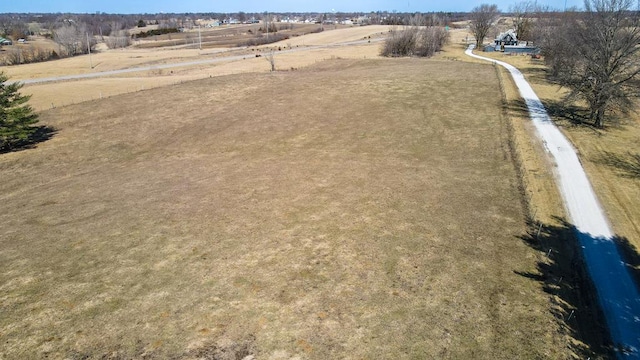 birds eye view of property featuring a rural view