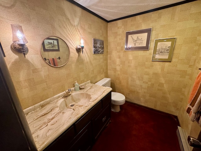 bathroom with toilet, crown molding, a baseboard radiator, baseboards, and vanity