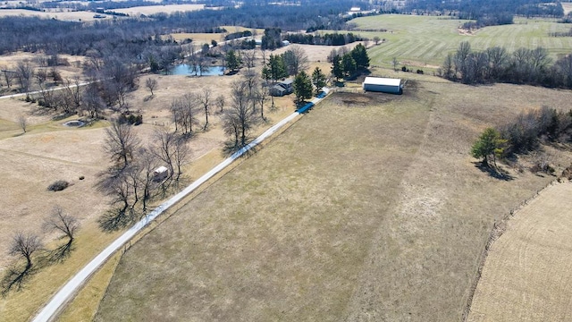 aerial view with a rural view and a water view